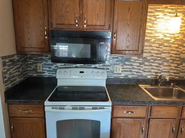 The same kitchen cleared and clean
