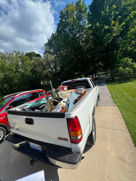 A pickup truck loaded with the pile